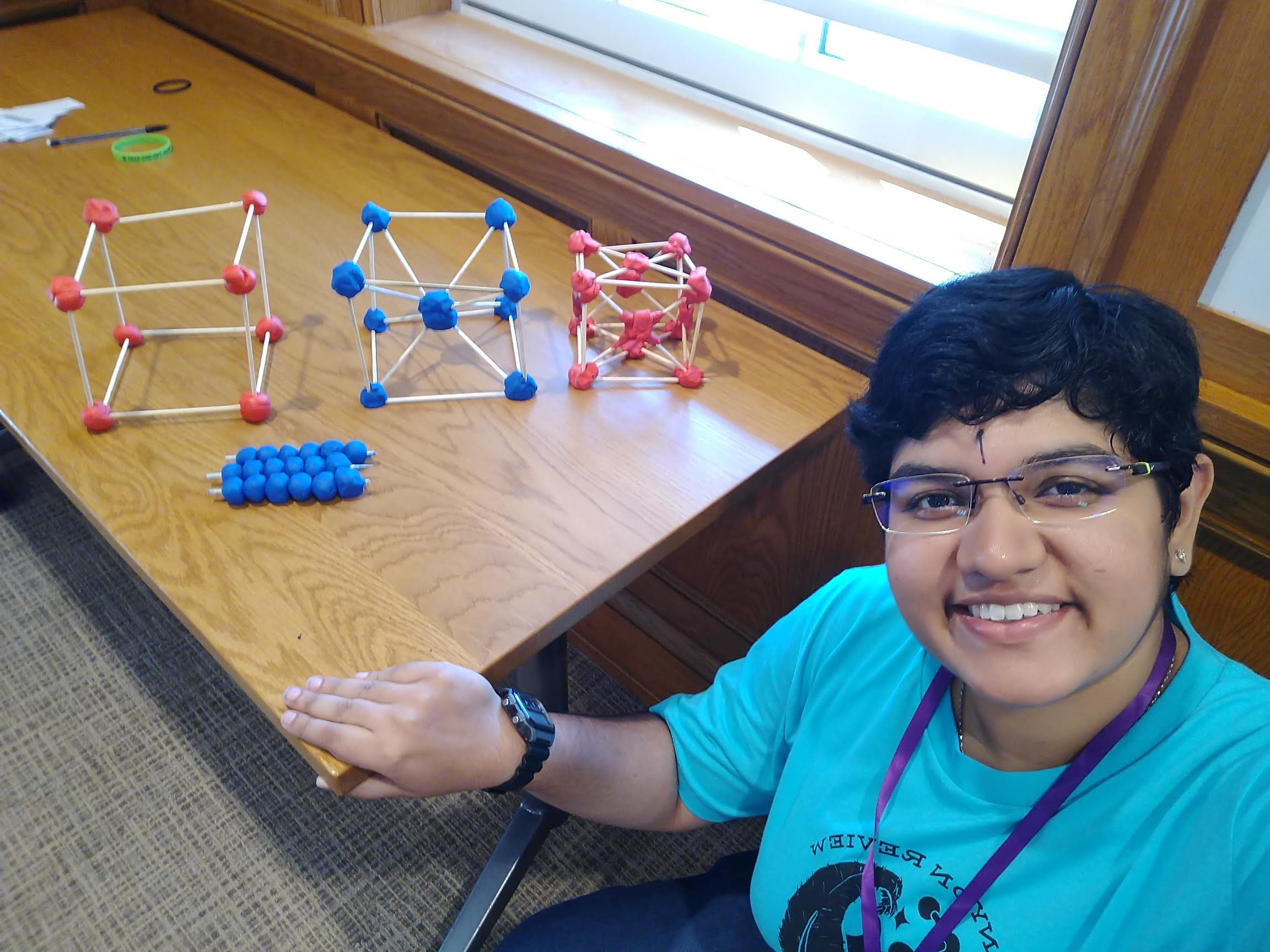 We built models of the three cubic Bravais lattices and three rows of close packed spheres to look at stacking.