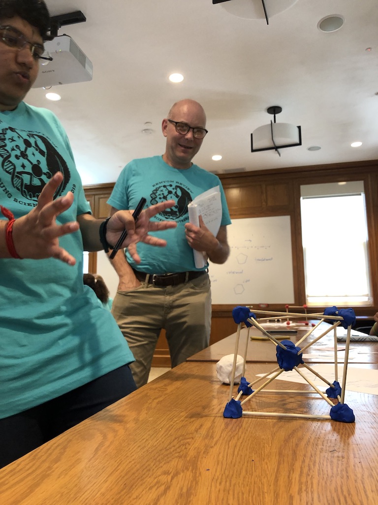 Here, I am engrossed in talking about the body centered cubic lattice as Prof. Chris looks on.